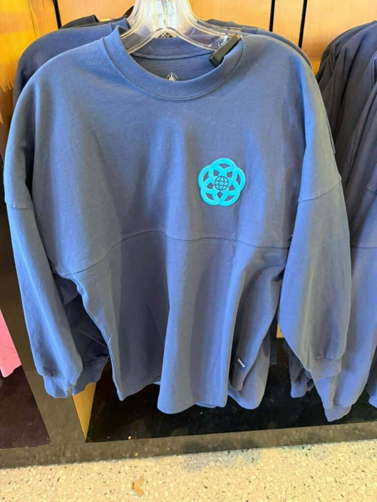 Blue sweatshirt with Disney Fashionista logo on front, casual style.