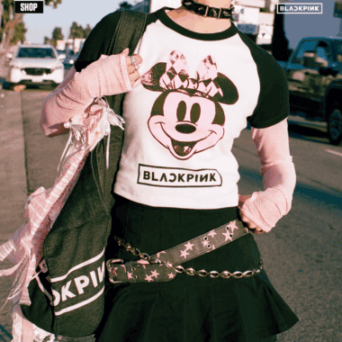 Woman wearing Minnie Mouse x Blackpink graphic T-shirt outdoors.