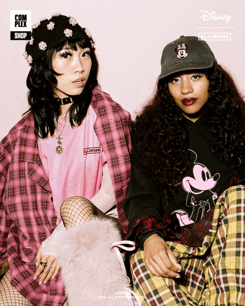 Two women in Disney-inspired streetwear outfits with bold accessories and plaid patterns.