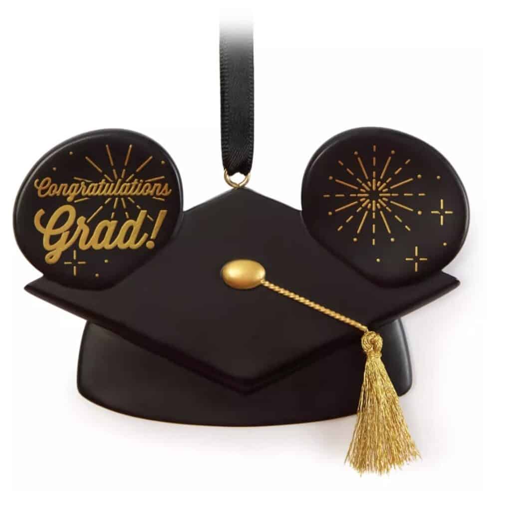 Graduation cap ornament featuring fireworks and "Congratulations Grad!" message, perfect for celebra.