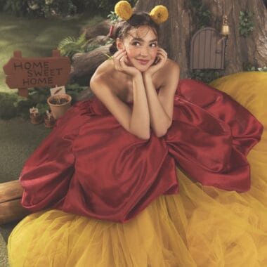 Whimsical Disney-inspired dress with playful accessories and vibrant colors.