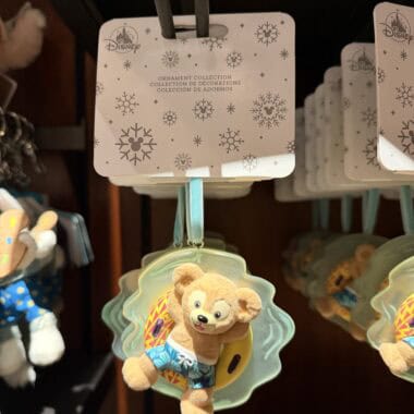 Cute Disney plush ornament featuring a bear in summer attire.