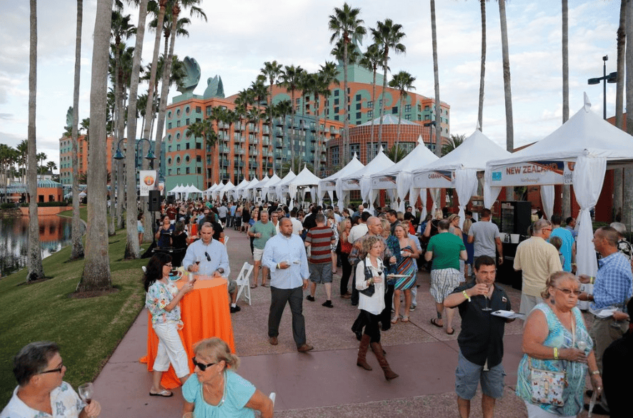 Elegant outdoor event at Disney Swan and Dolphin with food and wine tents.