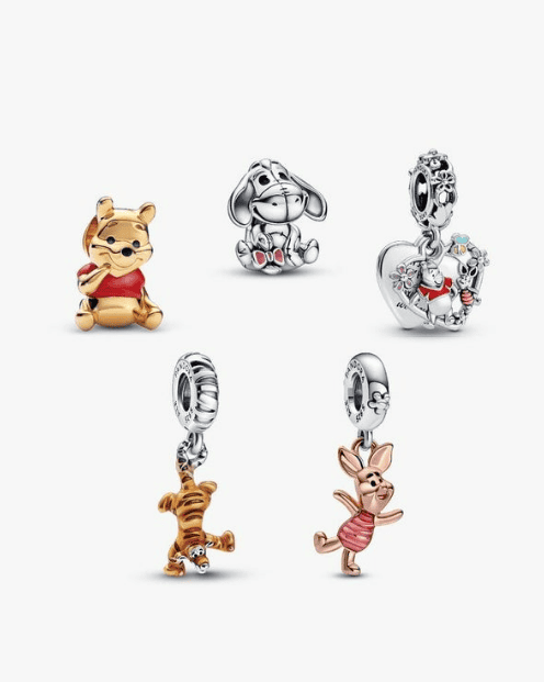 Disney Winnie the Pooh themed jewelry including charms and pendants.
