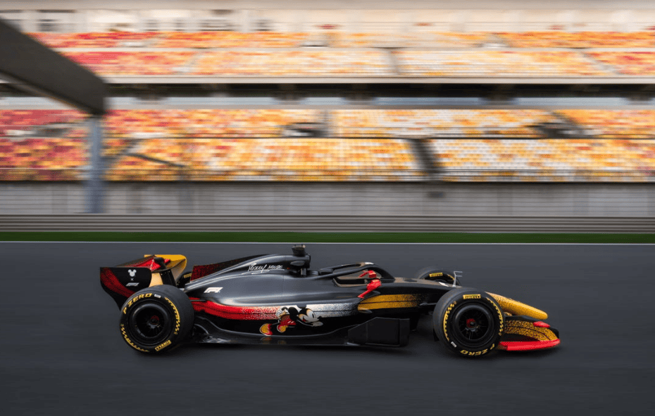 Formula 1 race car speeding on the track during a Disney-themed racing event.