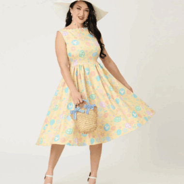 Vintage Easter dress with Disney-inspired pastel pattern and floral accents.