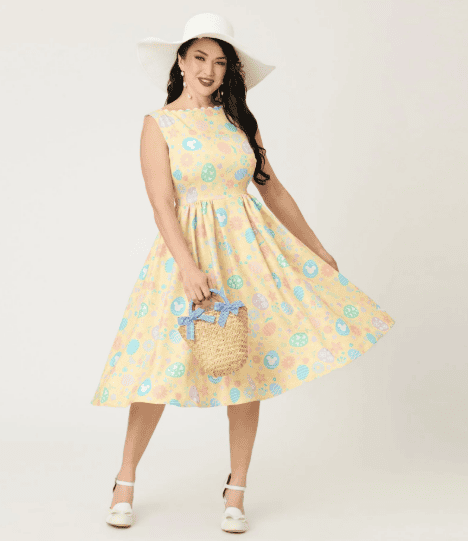 Vintage Easter dress with Disney-inspired pastel pattern and floral accents.