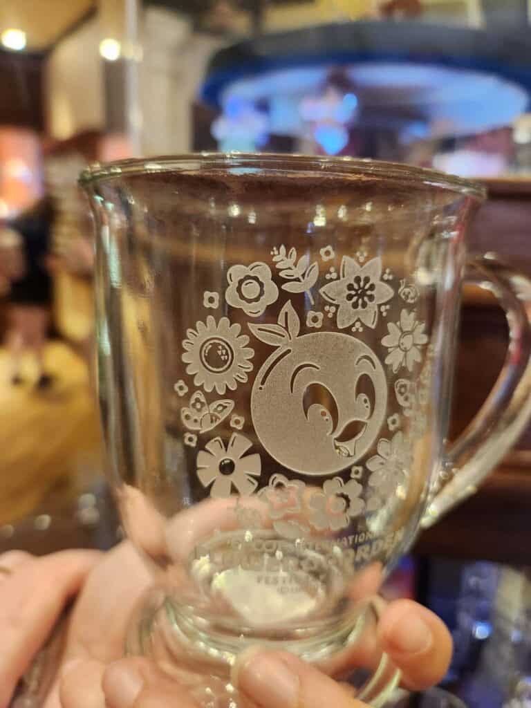 Disney character etched glass mug for beverages.