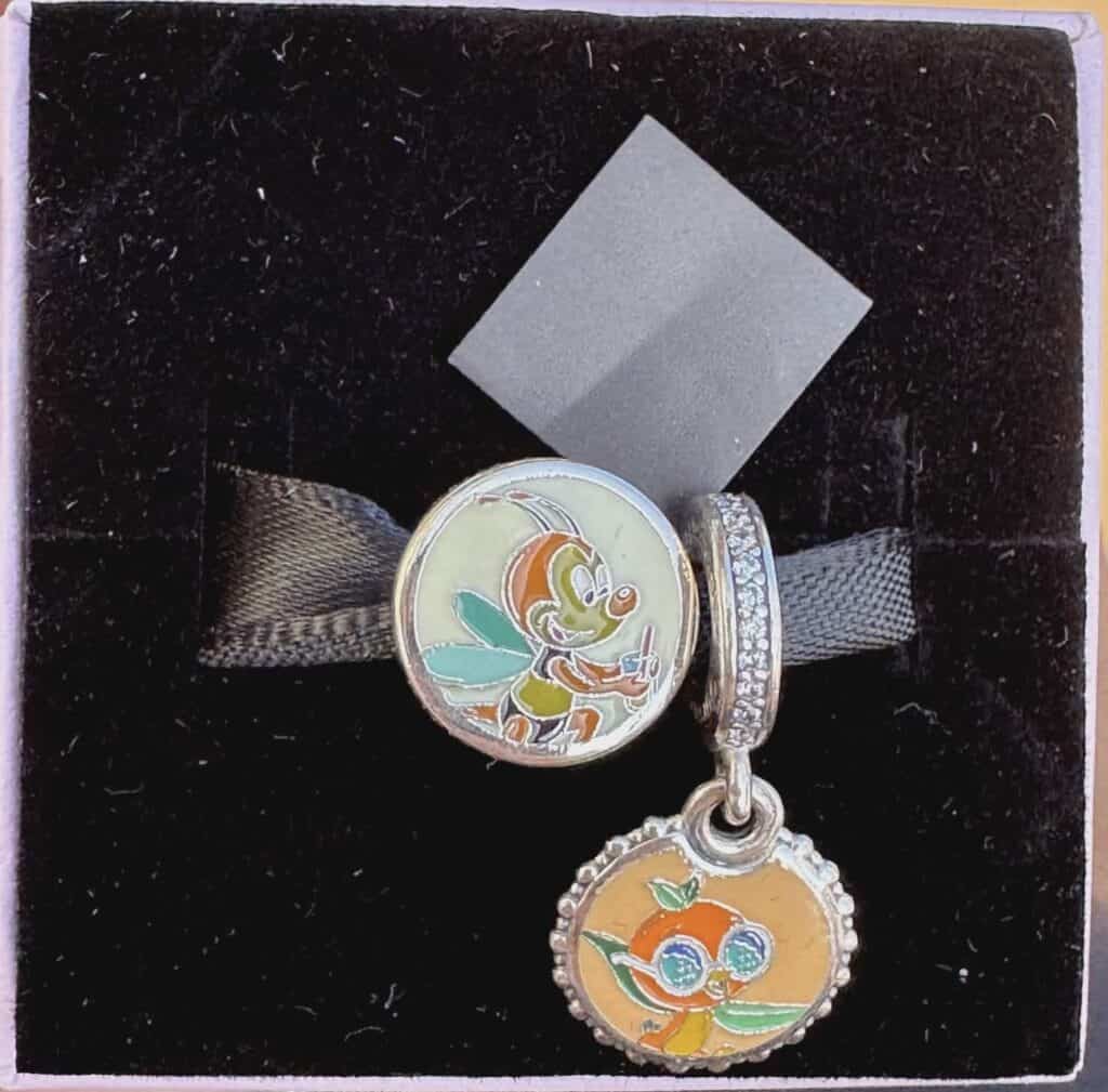 Disney Mickey Mouse and Donald Duck charm jewelry set with black ribbon.