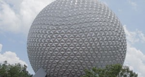 Spaceship Earth dominates Epcot, framed by lush trees and blue skies—a must-see landmark for every Disney World fan.