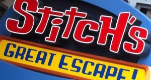 Vibrant “Stitch’s Great Escape!” sign in bold red, white, and yellow—a fan-favorite from Disney World’s Tomorrowland upgrades.
