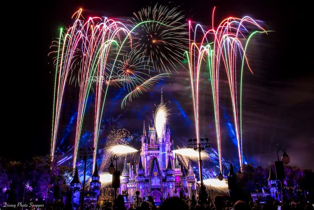 Fireworks burst over Cinderella Castle at Magic Kingdom as families gather, soaking up the excitement of Walt Disney World.