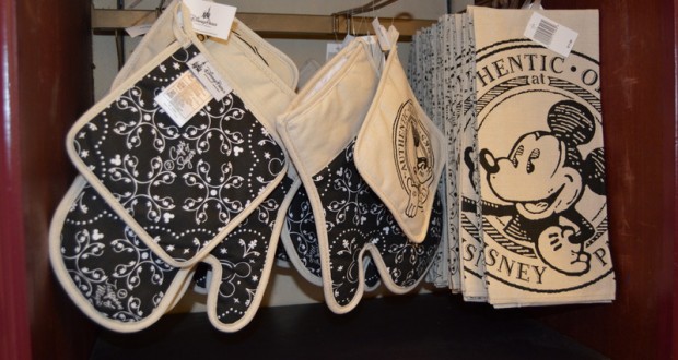 Black and white Mickey Mouse oven mitts, pot holders, and towels bring Disney Parks style to your kitchen shelf.