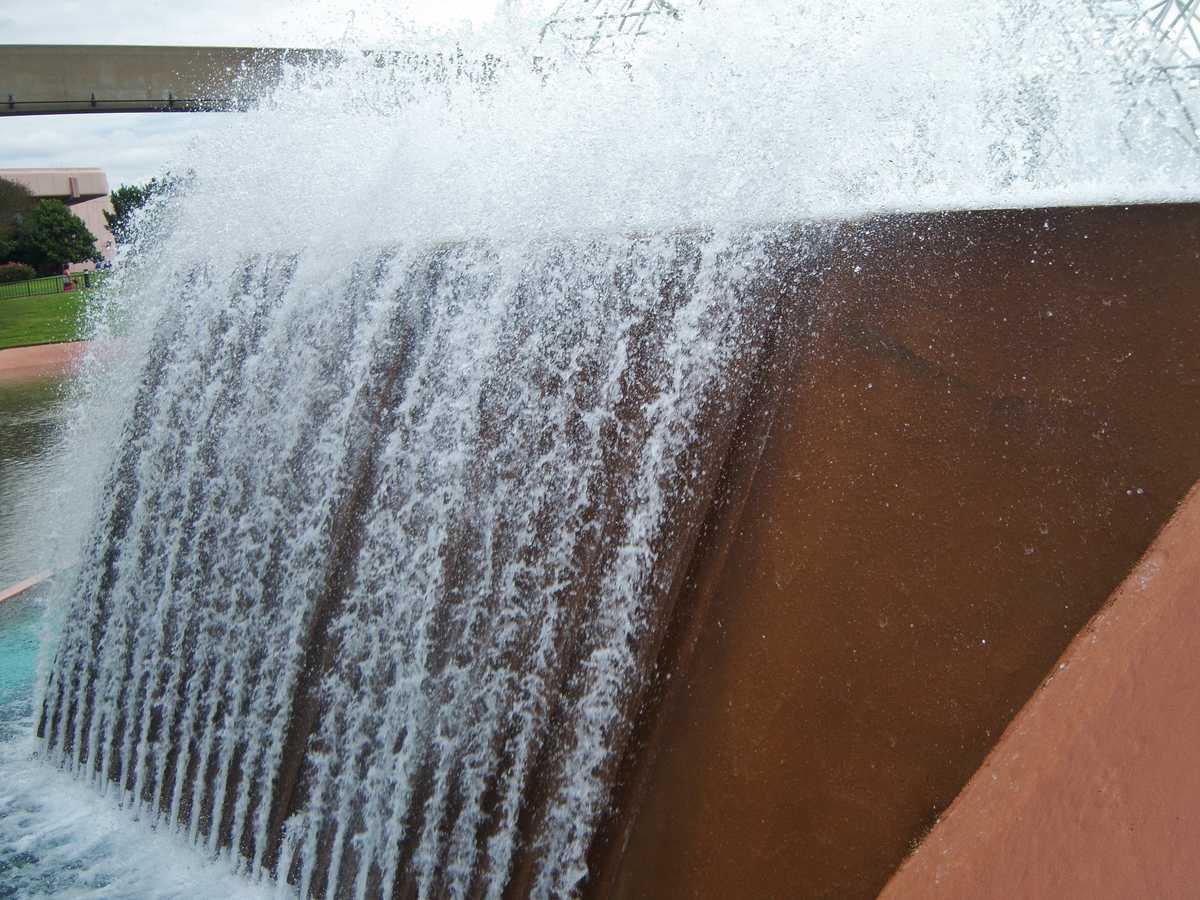 Water flows down a striking brown fountain at Epcot, one of Disney World's eye-catching attractions and hidden favorites.