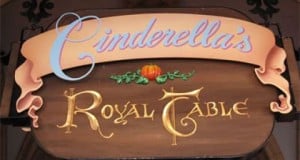 Cinderella’s Royal Table sign at Disney World features a pumpkin graphic, welcoming guests to this magical dining experience.