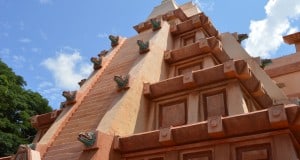 The iconic Mayan pyramid at Epcot’s World Showcase pops against a bright blue sky, inviting guests to explore its mysteries.