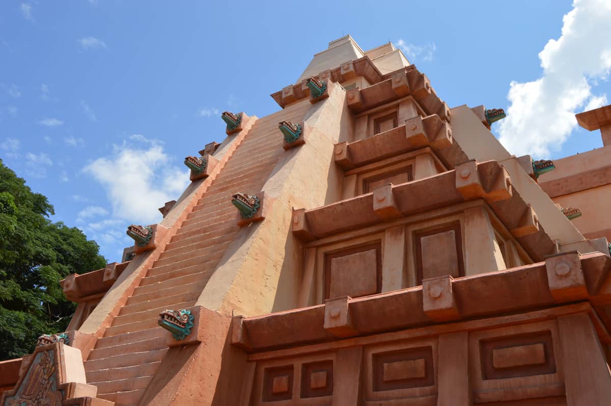 The iconic Mayan pyramid at Epcot’s World Showcase pops against a bright blue sky, inviting guests to explore its mysteries.
