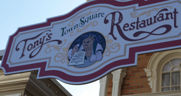 Tony’s Town Square Restaurant sign at Magic Kingdom, with a cartoon chef and menu inviting guests to classic Disney dining.