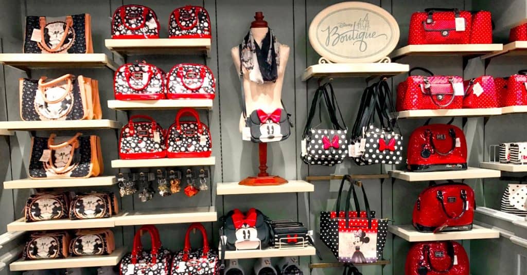 Disney-themed shelves showcase Minnie and Mickey handbags, wallets, and accessories—ideal keepsakes for Disney park enthusiasts.