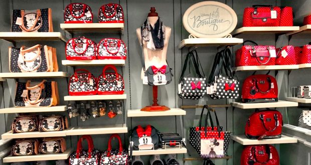 Disney-themed shelves showcase Minnie and Mickey handbags, wallets, and accessories—ideal keepsakes for Disney park enthusiasts.