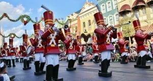 Toy soldiers march and play music down a festive Disney parade route, delighting crowds with this iconic holiday tradition.
