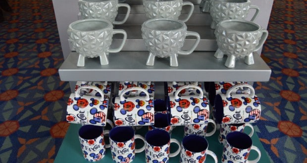 Gray EPCOT mugs sit above vibrant Walt Disney World mugs featuring Mickey Mouse and EPCOT logos, a must for Disney park fans.