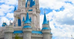 Cinderella Castle with its blue rooftops and soaring spires rises above Magic Kingdom, a must-see Disney World attraction.