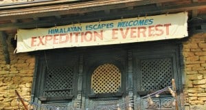 The "Himalayan Escapes Welcomes Expedition Everest" banner greets fans above a stone building in Disney’s Animal Kingdom.