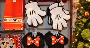 Mickey and Minnie hand-shaped oven mitts add extra holiday magic to Disney World shops, perfect for festive park-goers.
