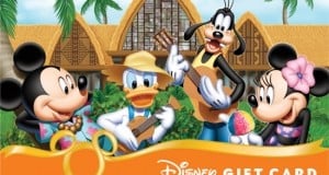 Mickey, Donald, Goofy, and Minnie jam with music and treats in front of a lush tropical building at Disney World. Gift Card.