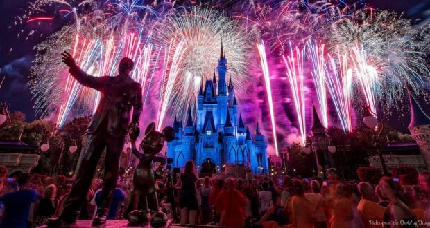 Castle_Night_Fireworks_Pink_MickeyWaltStatue