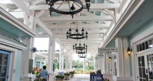 Old Key West Resort’s open house features a chandelier-lit, covered check-in area with white beams and themed event signage.