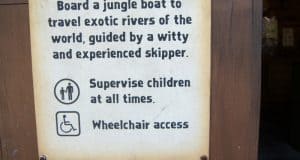 Jungle Cruise attraction sign featuring trivia, a reminder for child supervision, and details on wheelchair accessibility.
