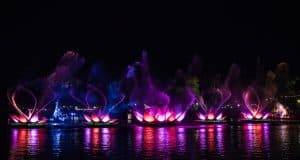 Dazzling illuminated lotus floats and fountains light up Animal Kingdom’s lake at night, creating unforgettable Disney magic.