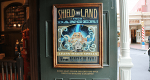 Poster on a door exclaims: “Protect this land! Kids can do hands-on activities and learn spells—just like Walt Disney World!”.