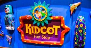 Kidcot Fun Stop sign with playful animal designs pops against a blue background—one of Disney World's must-try free activities.