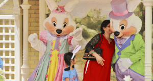 Guests enjoy a magical photo op with the Easter Bunnies outside Walt Disney World, creating unforgettable family memories.