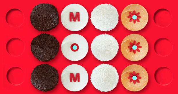 Cookies arranged in four rows spell “MOM” on bright red, some with floral designs—ideal for Disney World's Mother's Day treats.