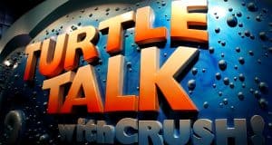 The vibrant "Turtle Talk with Crush!" sign pops against an underwater backdrop, inviting Disney World guests to catch showtimes.