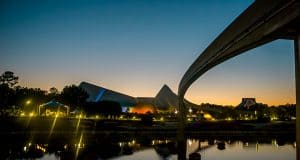 Epcot’s Spaceship Earth and monorail glow at sunset, their reflections shimmering on World Showcase Lagoon—a Disney must-see.