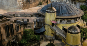 A futuristic model of domed buildings with trees and guests, evoking the Star Wars: Galaxy’s Edge atmosphere at Disney parks.