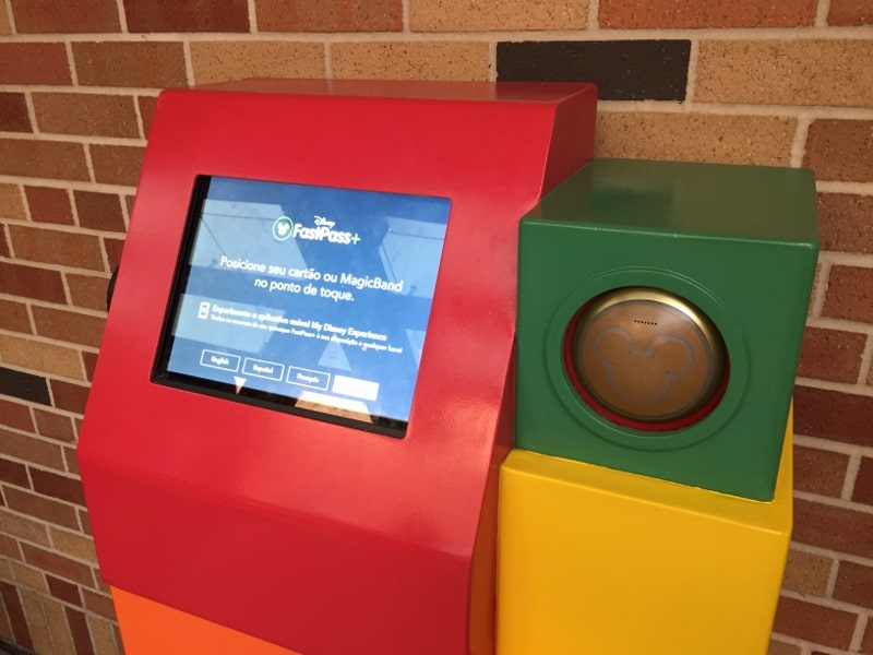 FastPass+ kiosk with screen and MagicBand reader at Walt Disney World, perfect for guests planning park adventures.