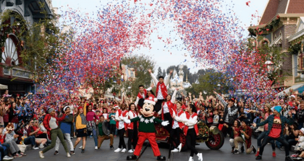 Mickey Mouse and the cast light up Disneyland’s Christmas Celebration as red, white, and blue confetti bursts overhead on ABC.
