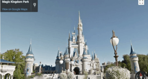 Cinderella Castle at Magic Kingdom, gleaming beneath blue skies, framed by lush trees and iconic lamp posts in Disney World.