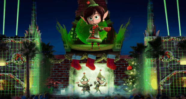 Christmas elf performs onstage among gifts, stockings, vibrant lights, and festive decor at the Jingle Bell Jingle BAM Dessert Party.