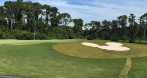 On the golf course green, a Mickey Mouse-shaped bunker mirrors the whimsy of Walt Disney World’s signature design.