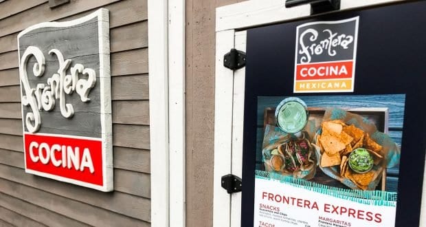 The Frontera Cocina Mexicana sign and menu outside welcome Disney Springs visitors to a vibrant dining spot at Walt Disney World.