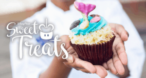 Cupcake with blue frosting, seashell candies, and a mermaid tail topper at Disney World. Text: “Sweet Treats.”.