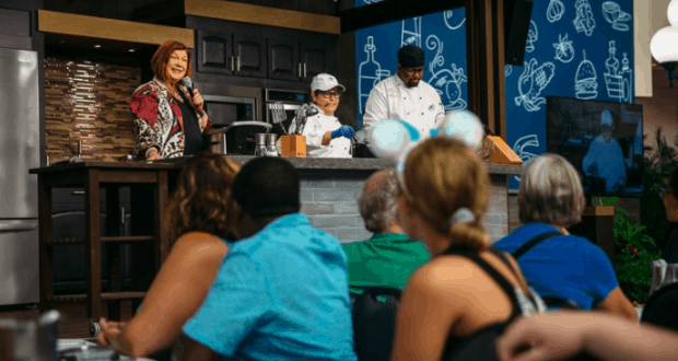 A lively Food & Wine Tailgate demo excites Disney World guests, as chefs and a host channel Monday Night Football energy onstage.