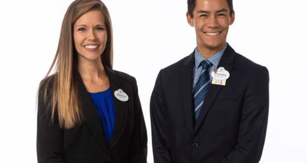 The 2019-2020 Walt Disney World Ambassadors, smiling in business attire with name tags, stand against a white backdrop.